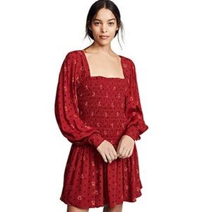 Free people NWOT red along sleeve mini dress.  Perfect for the holidays